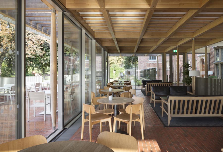 light multi quarry tiles merge inside and out at the new cafeteria pavilion Jesus College Cambridge